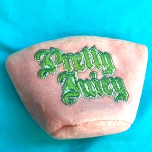 Juicy Couture lite pink change purse with lipstick charm attached to zipper top